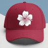 Casquette rouge avec fleur en hibiscus Blanche. Jolie modèle qui s'adapte aussi bien pour les hommes comme pour les femmes.